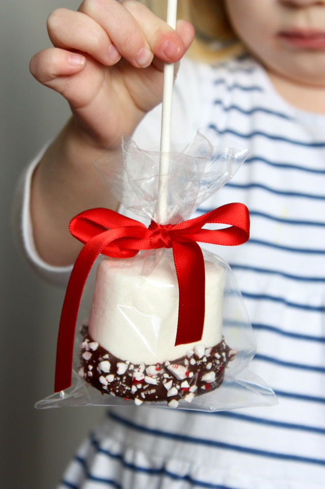 Dipped in chocolate marshmallows with a red bow.