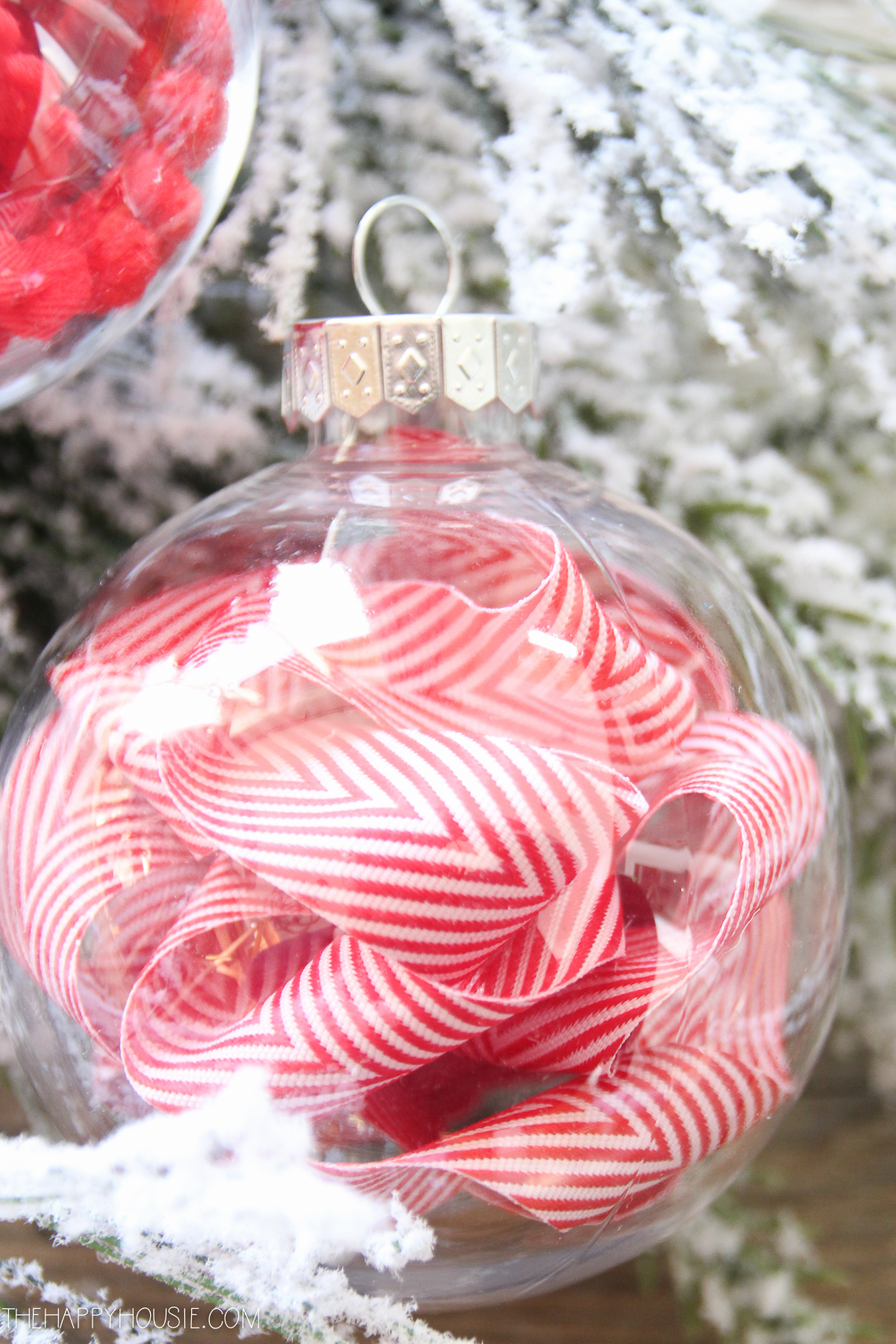 Red and white ribbon in the ornament.