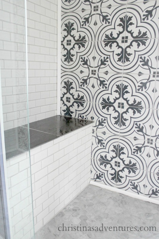 A floral patterned tile in the bathroom.