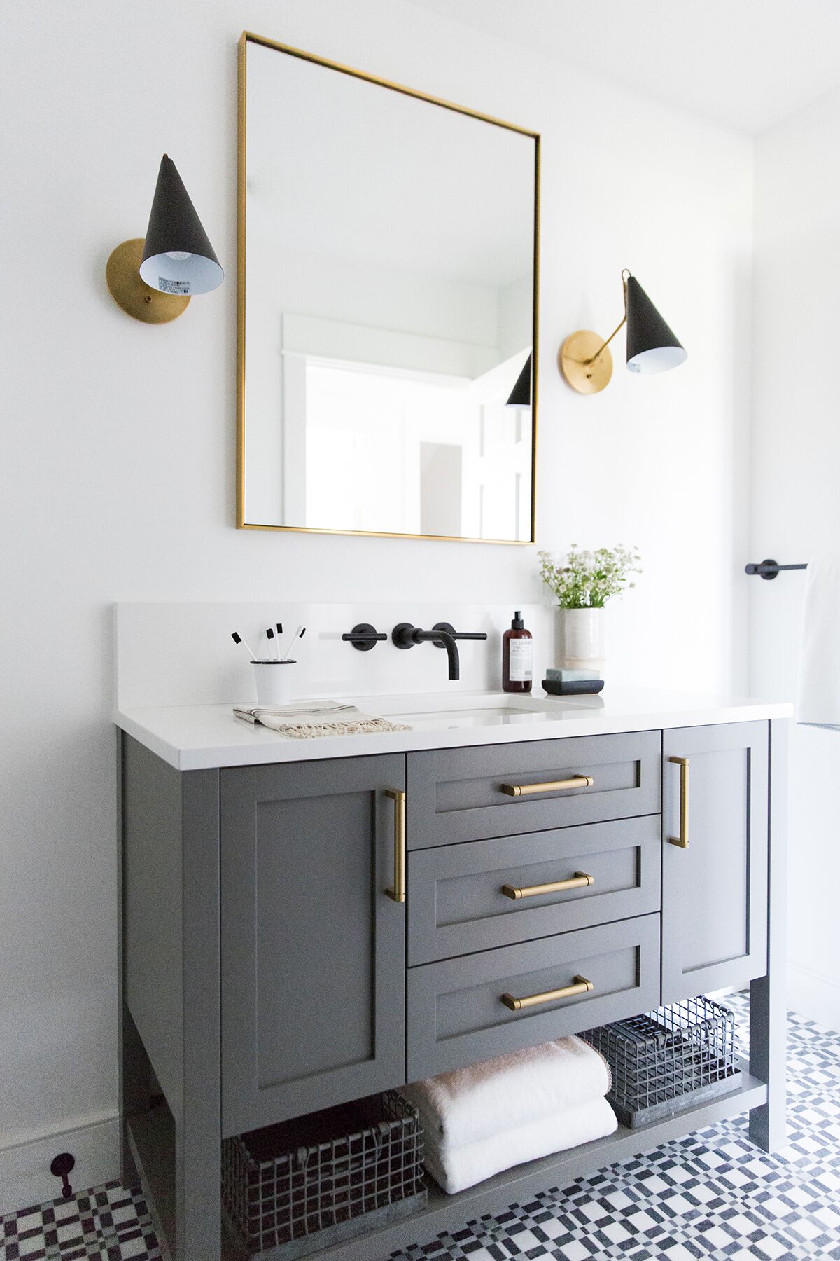 A blue/grey cabinet with gold hardware.