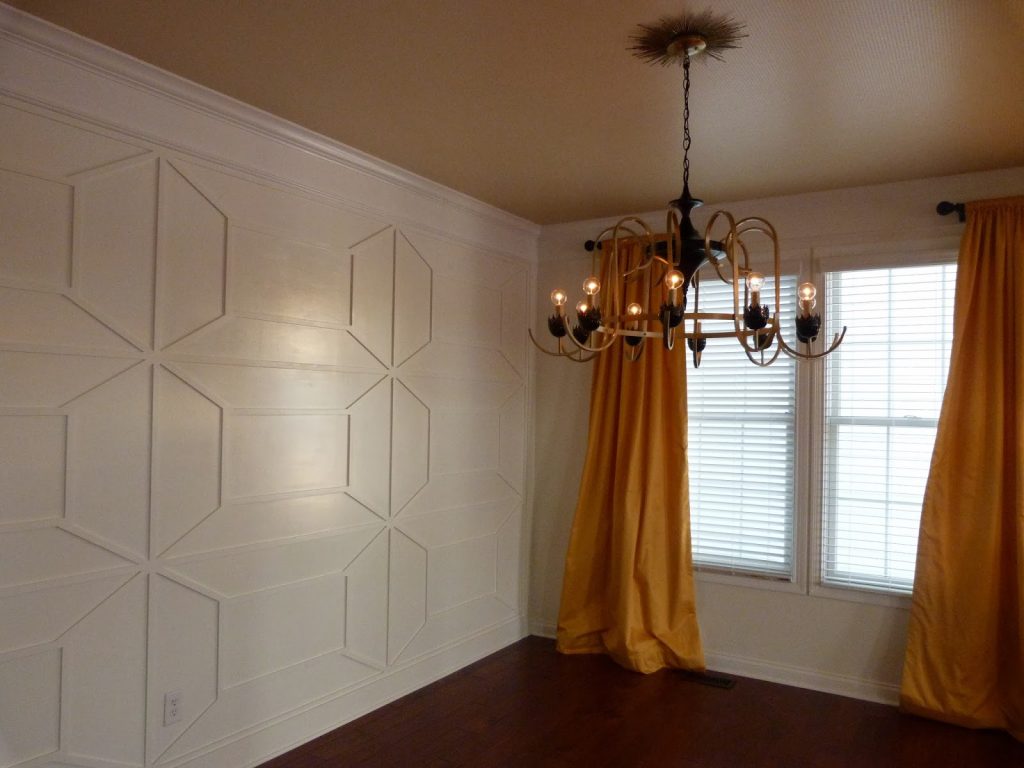 White panelled walls in a dining room.