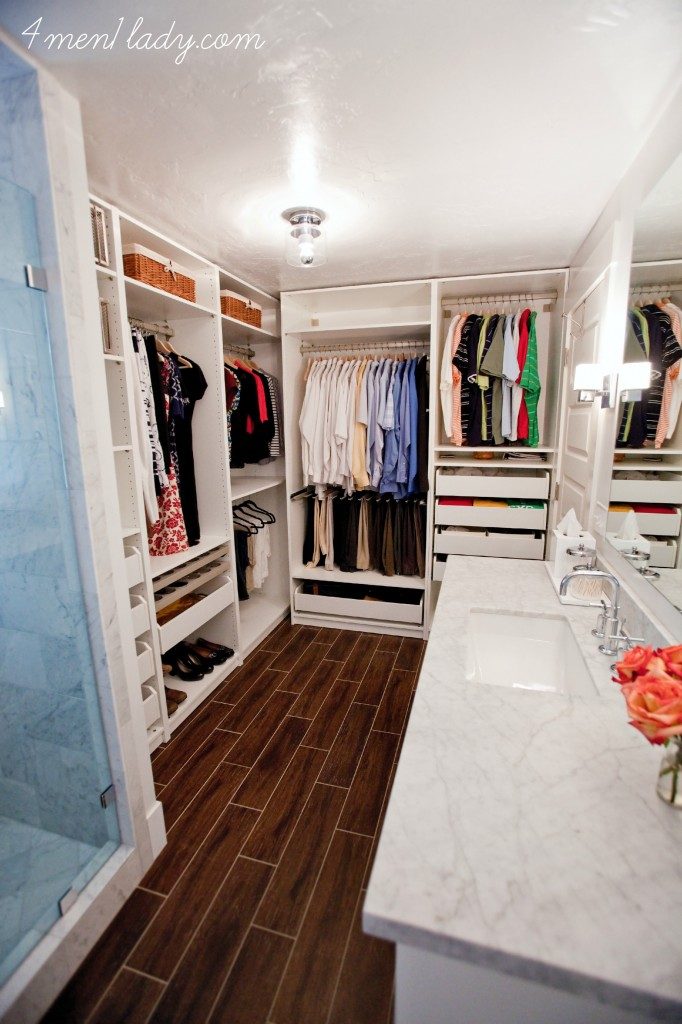 an Ikea PAX wardrobe unit without doors used in a bathroom to provide clothing storage 