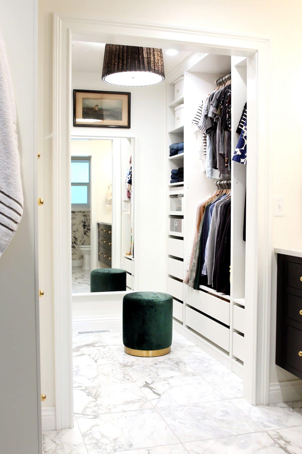a walk-in closet that uses the Ikea PAX wardrobe system to create a functional and organized place for clothing storage 