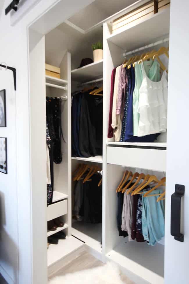 a highly organized small closet that uses the Ikea PAX wardrobe system to make the most of a small closet space