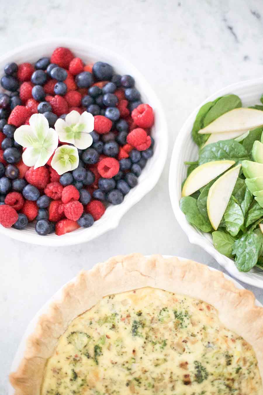 Quiche and berries on the table.
