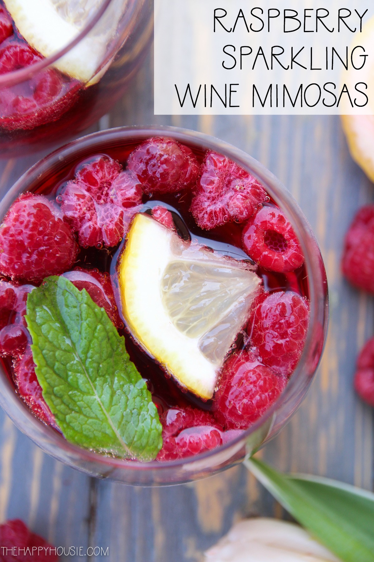 Raspberry sparkling wine mimosas graphic.