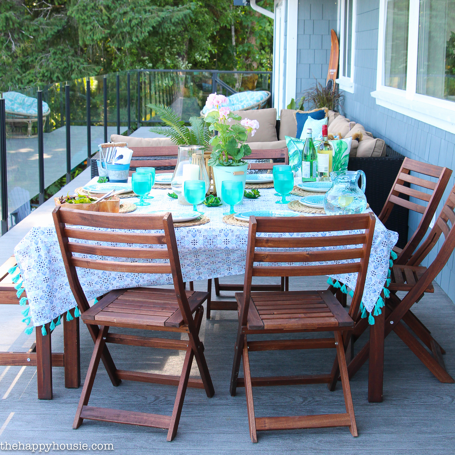 A table set for eating on the porch.