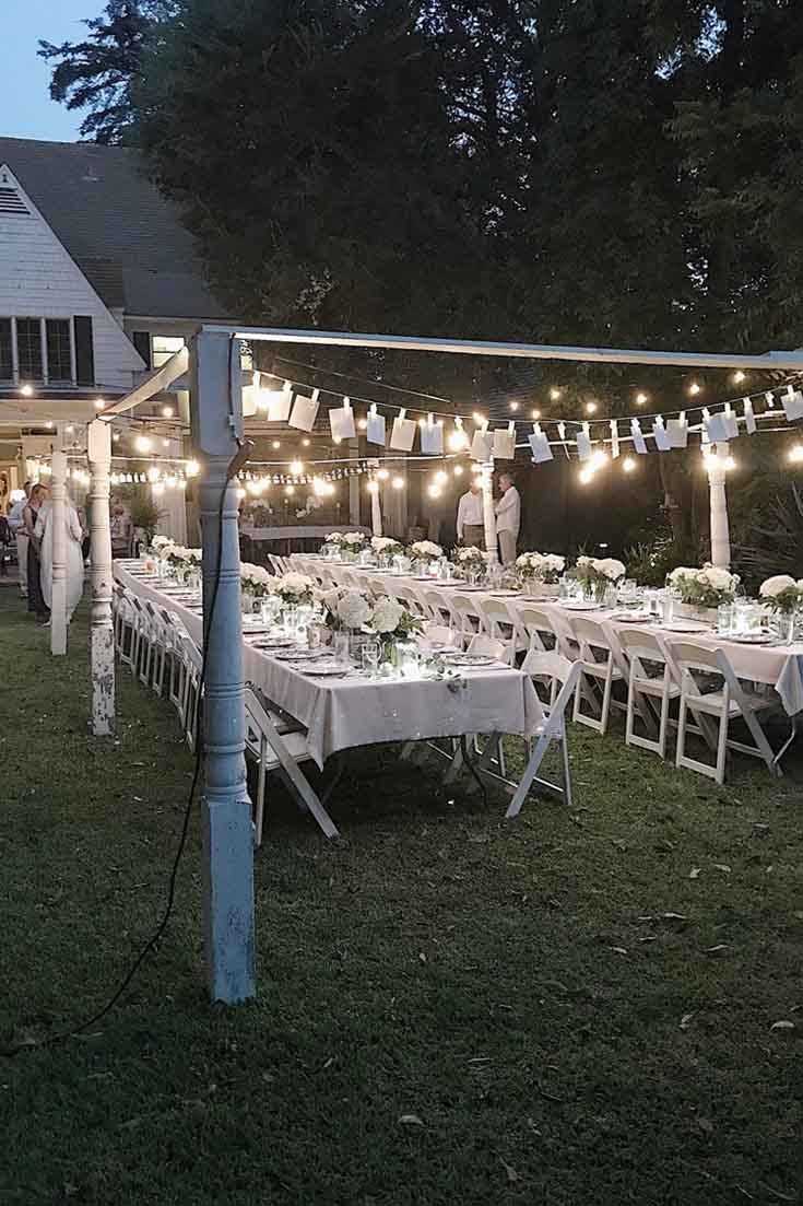 The lights are twinkling above the decorated tables.