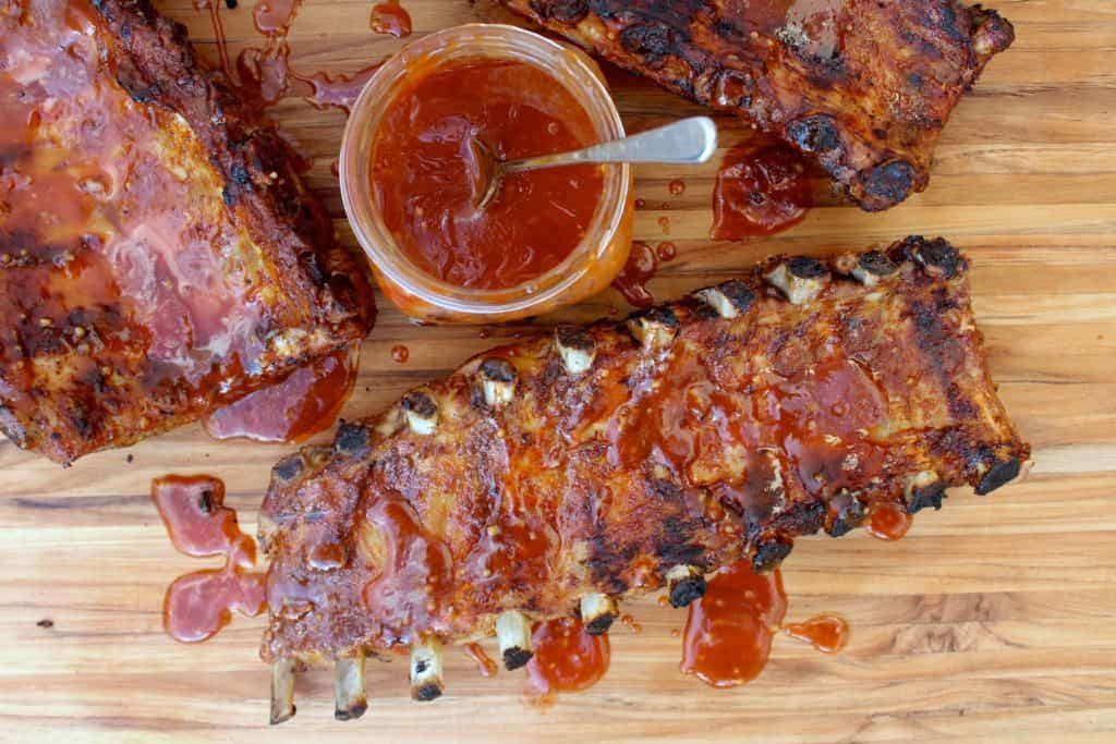 Baby back ribs that were grilled with bbq sauce.