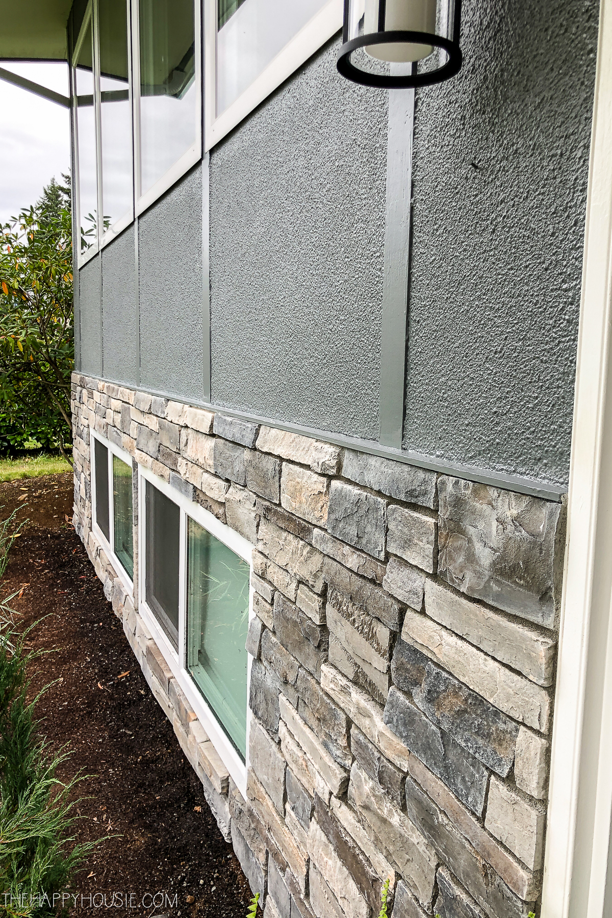 Cultured stone on the bottom portion of the house.