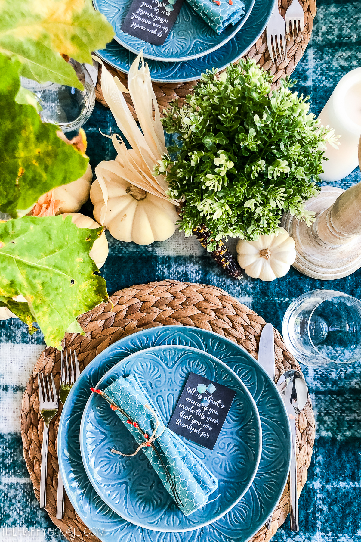 Blue plates on a woven placemat.