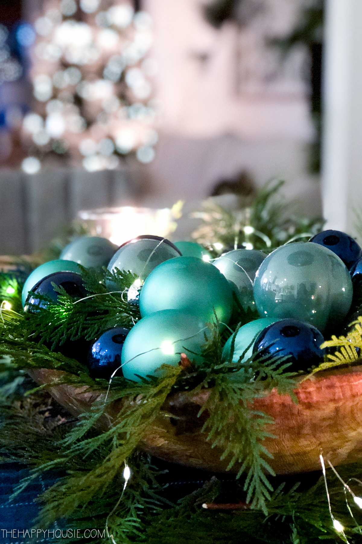 Up close picture of the blue and green ornaments on the table.