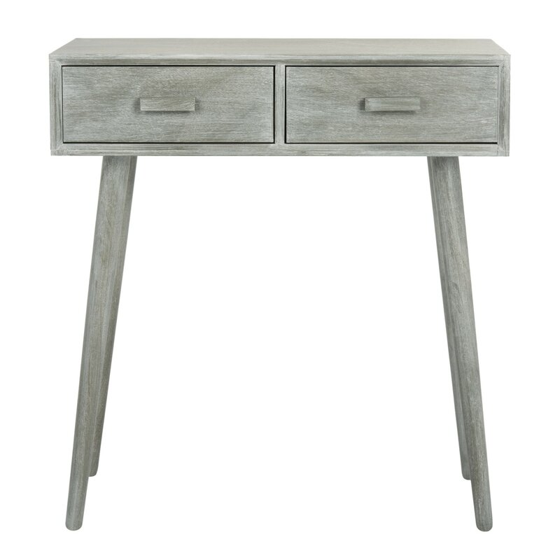 A small console table with drawers.