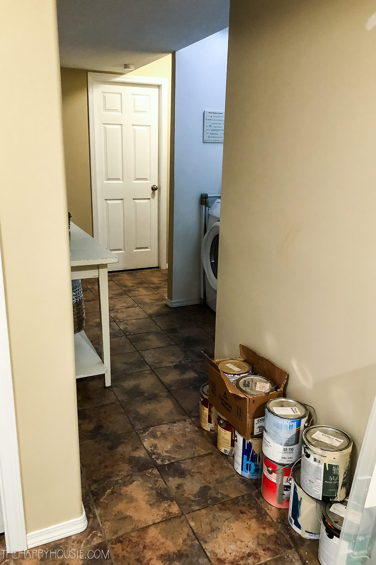a laundry nook off a basement hallway 
