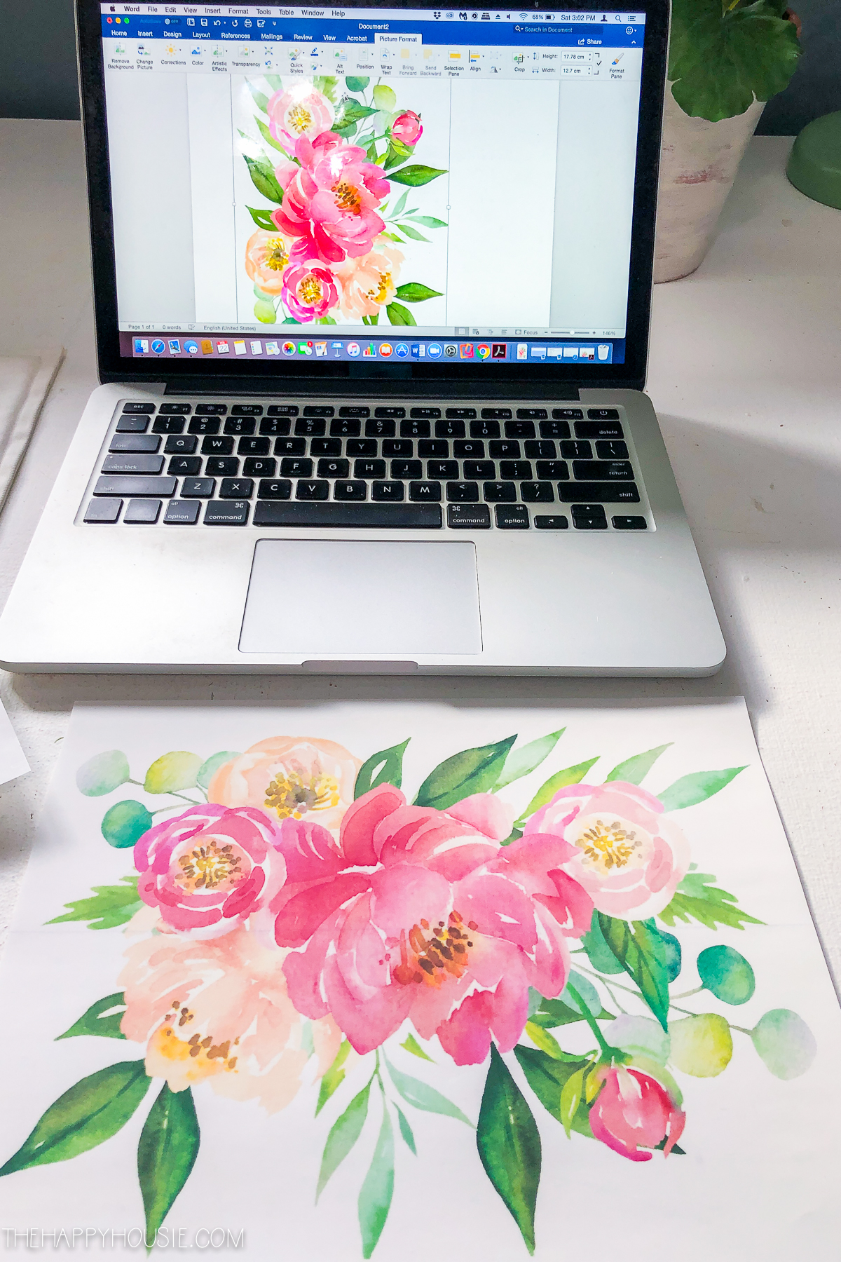 A floral graphic on a laptop.