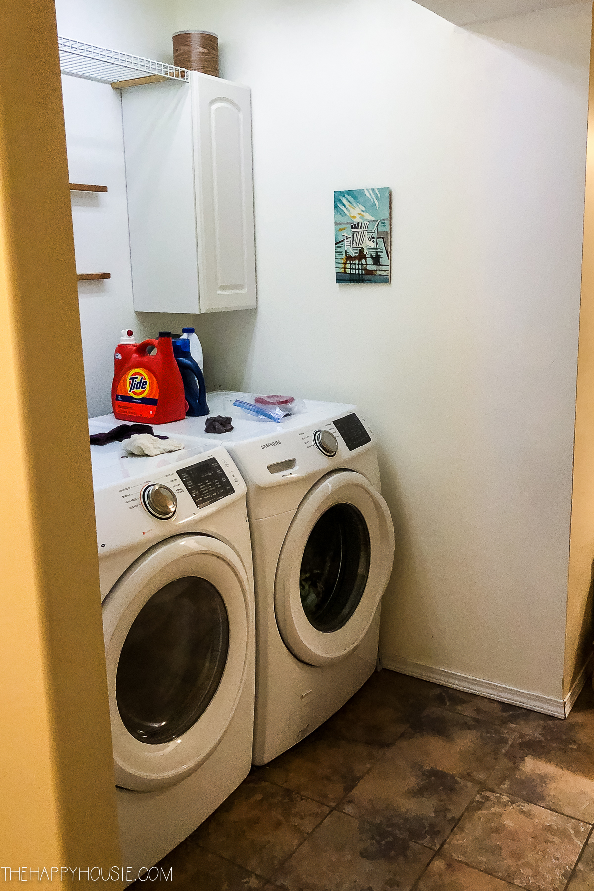 A washer and dryer in the alcove.