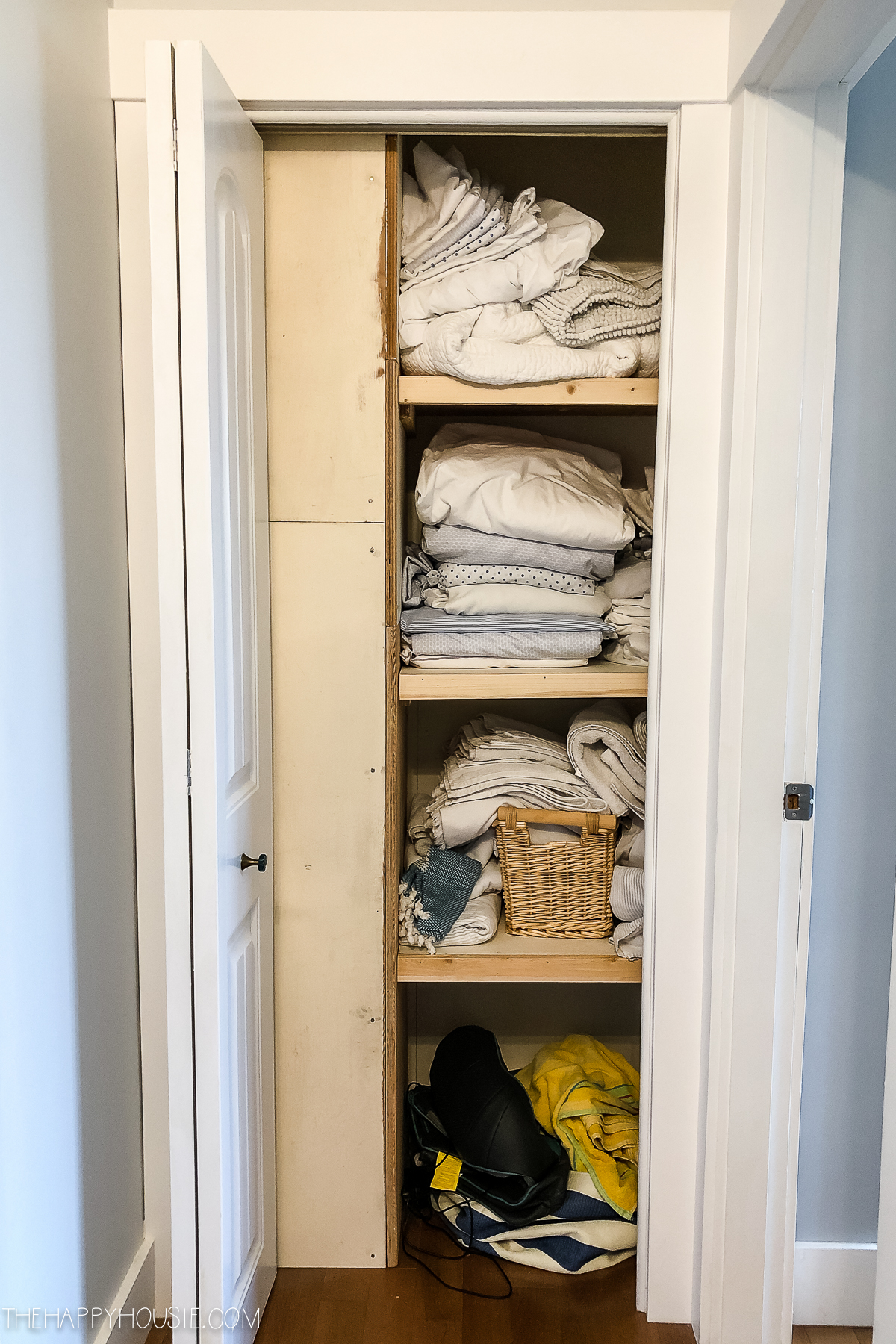 A disorganized linen closet.