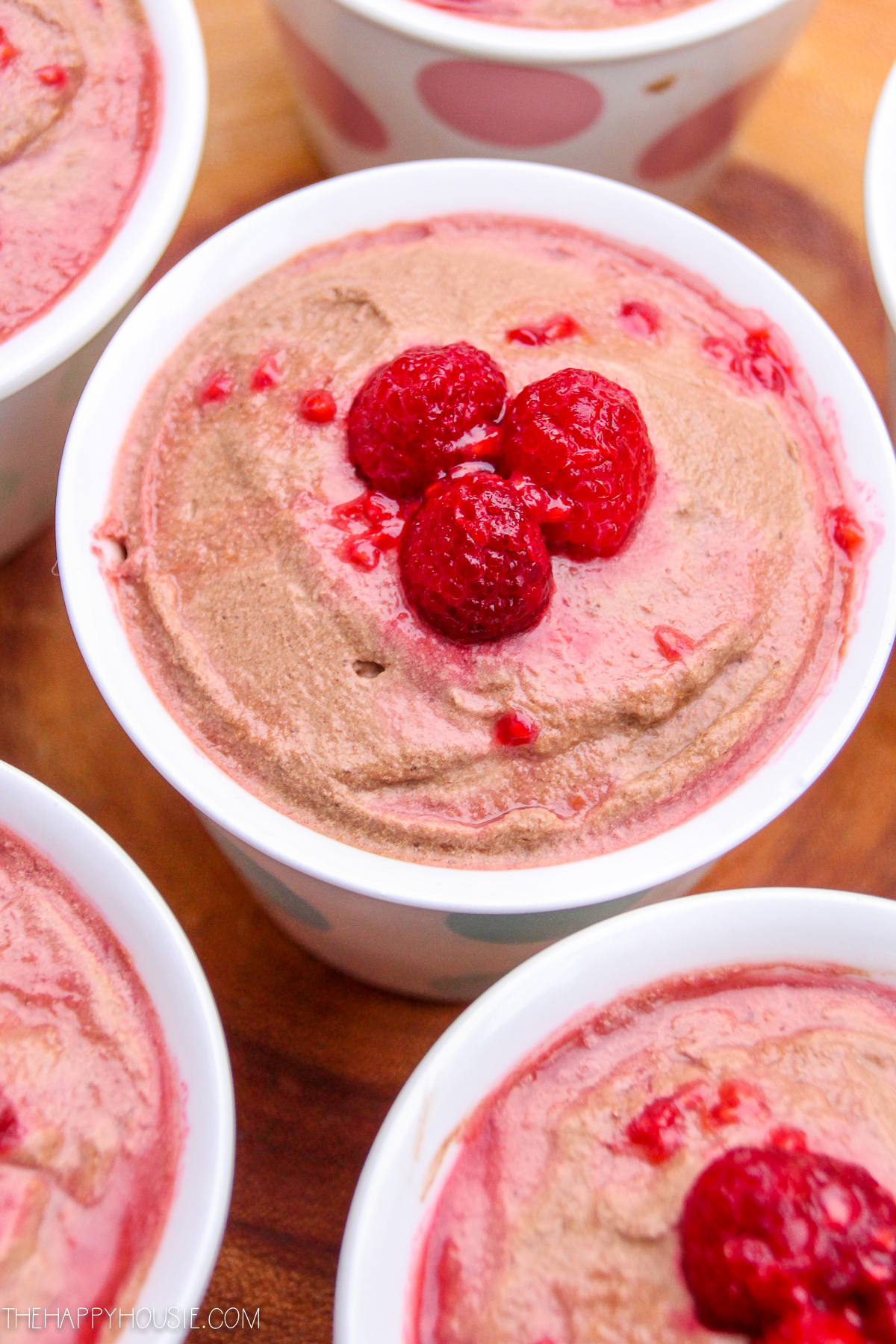 Up close picture of the raspberries top of the mousse.