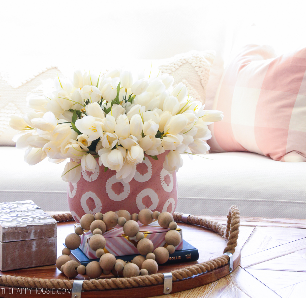 White tulips on the coffee table.