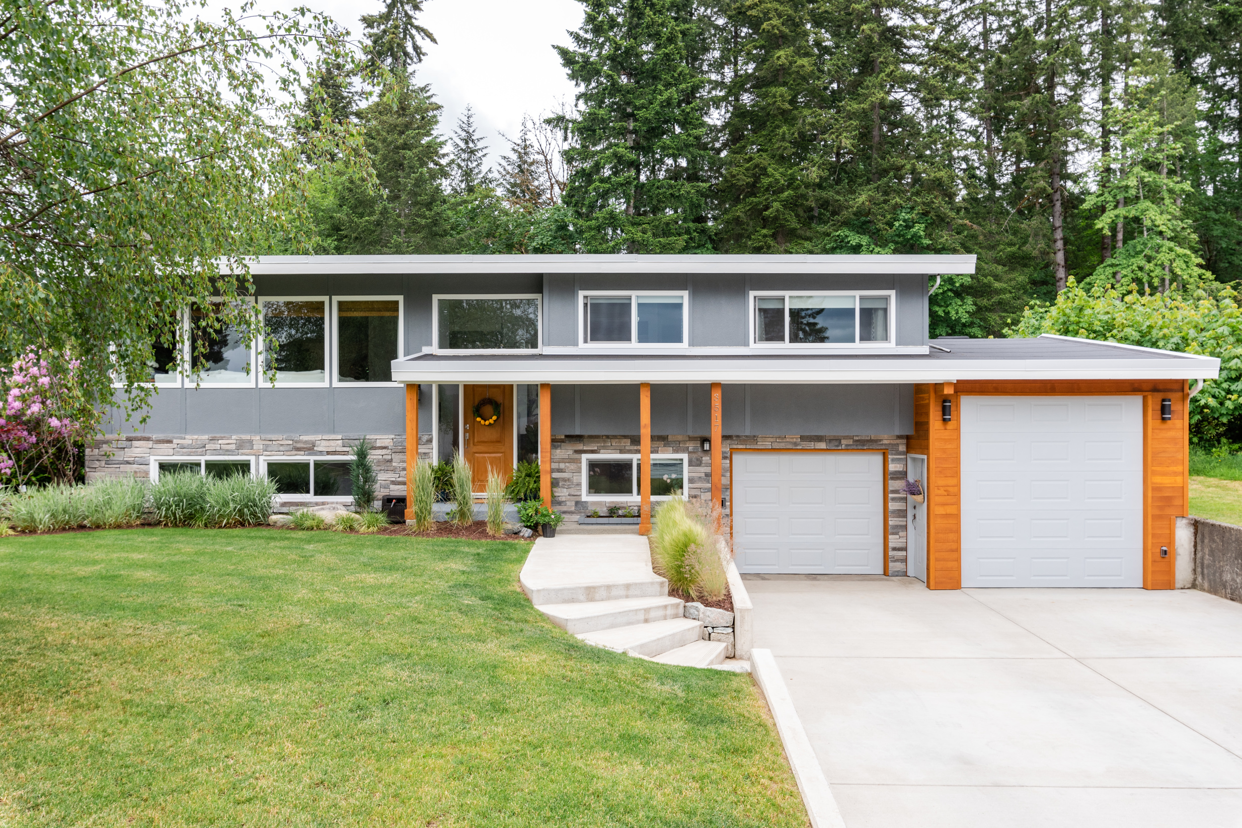 A freshly updated and renovated split level home with cedar and rock accents