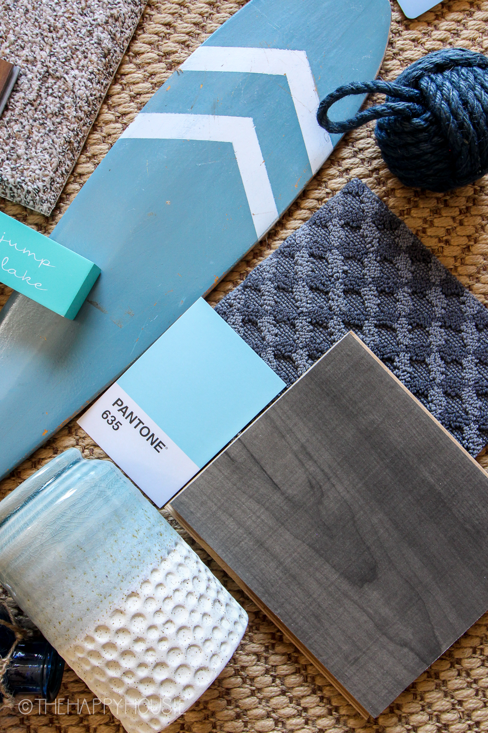 Swatches of colour and flooring samples in a blue grey.