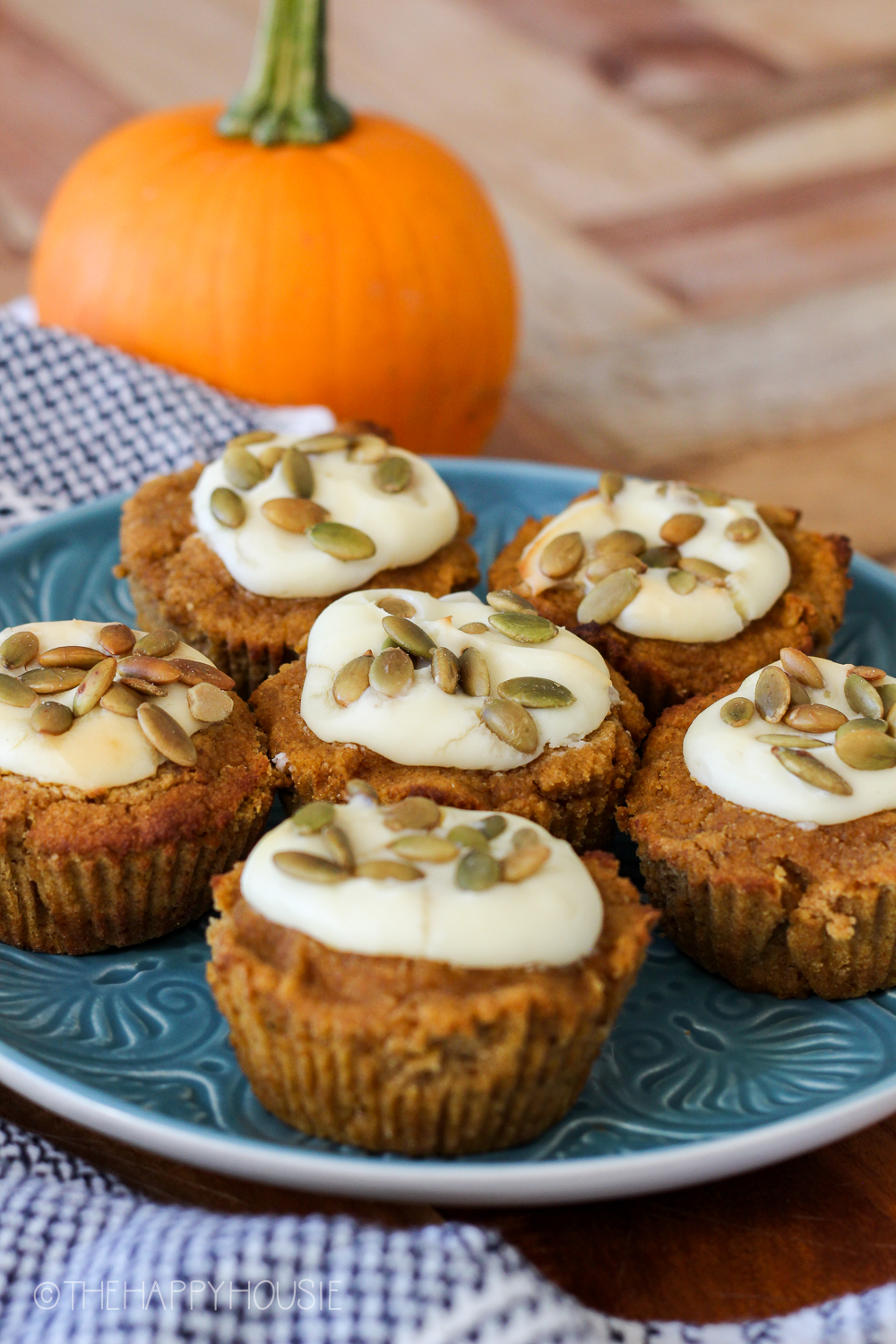 Muffins topped with pumpkin seeds.