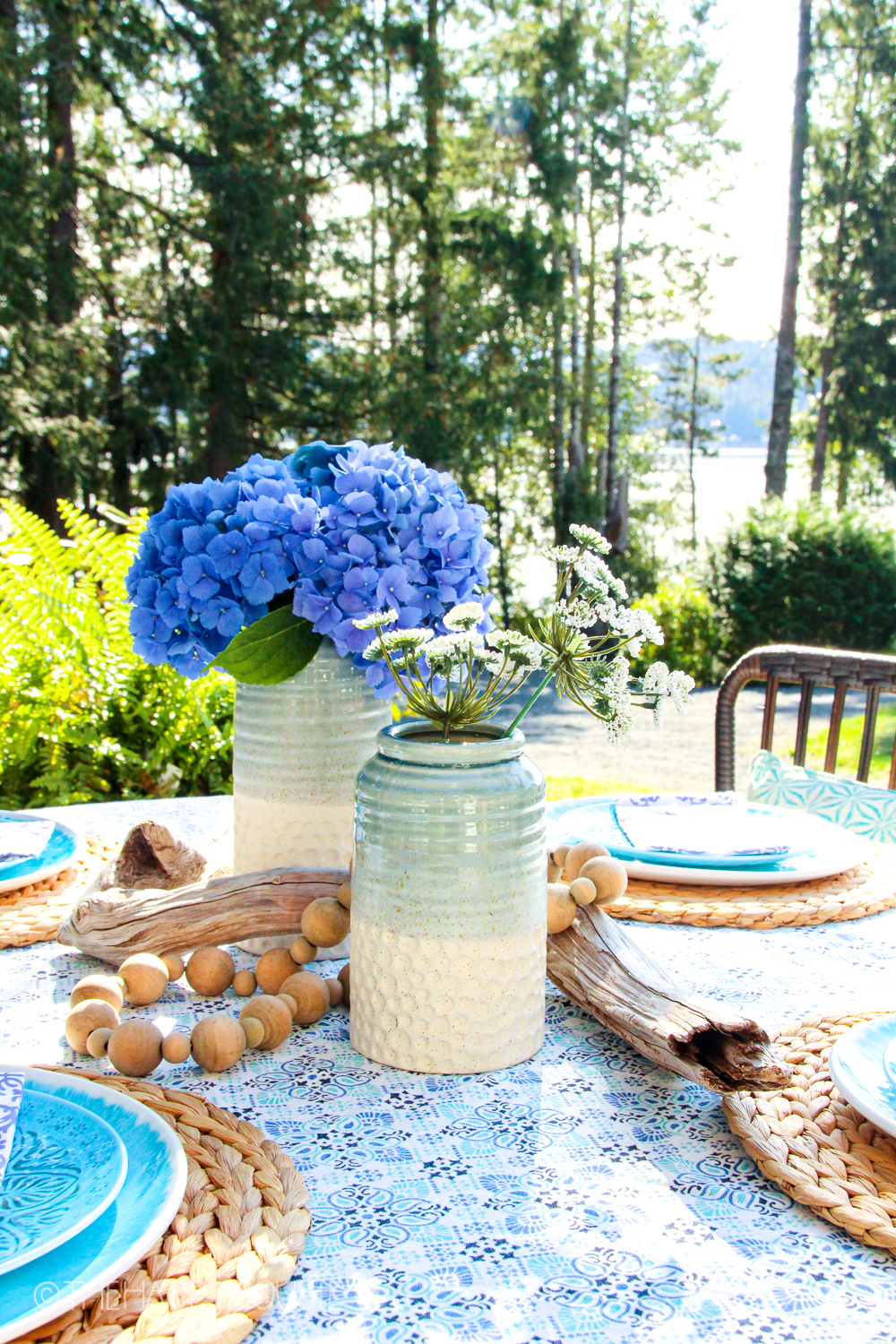 An outdoor table set with touches of blue.