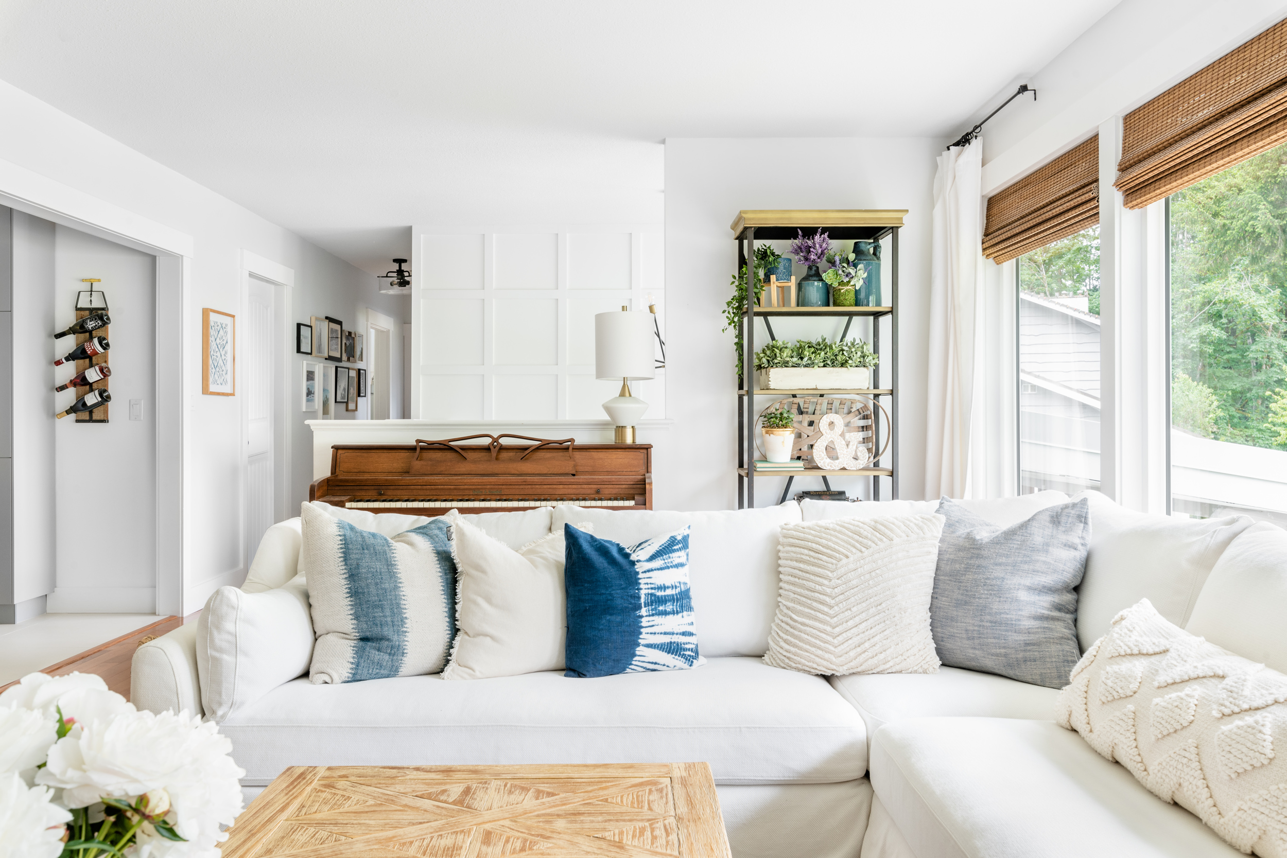 a light and bright living room with a white Ikea Farlov slipcovered sectional sofa