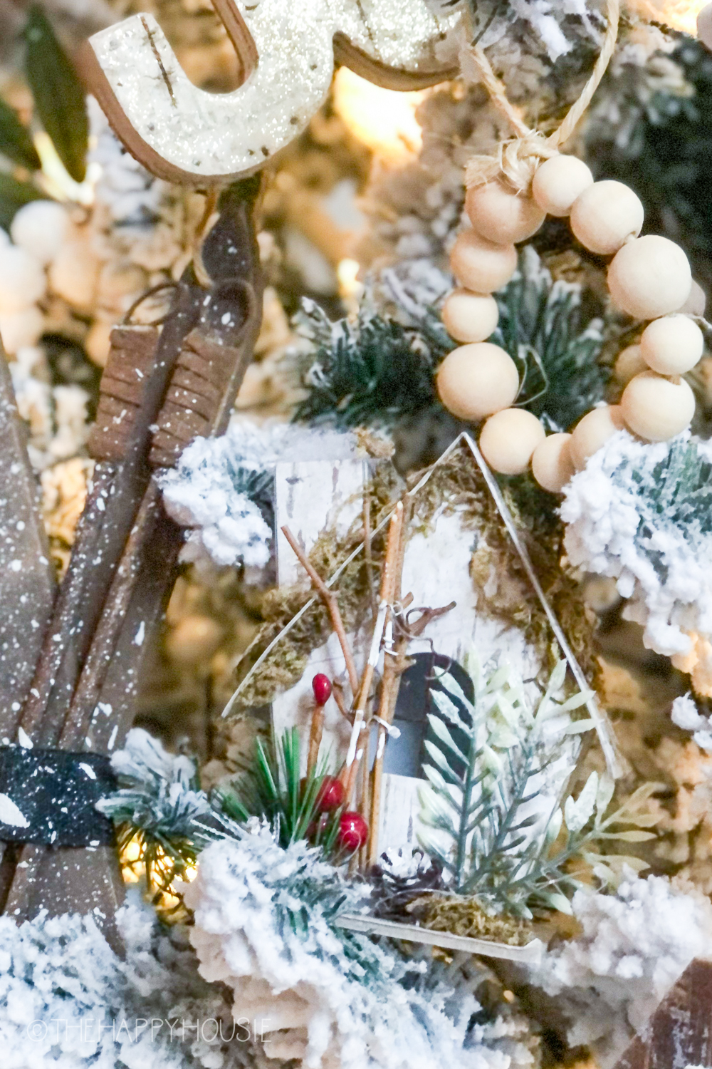 Little wooden houses and wood beads on the Christmas tree.