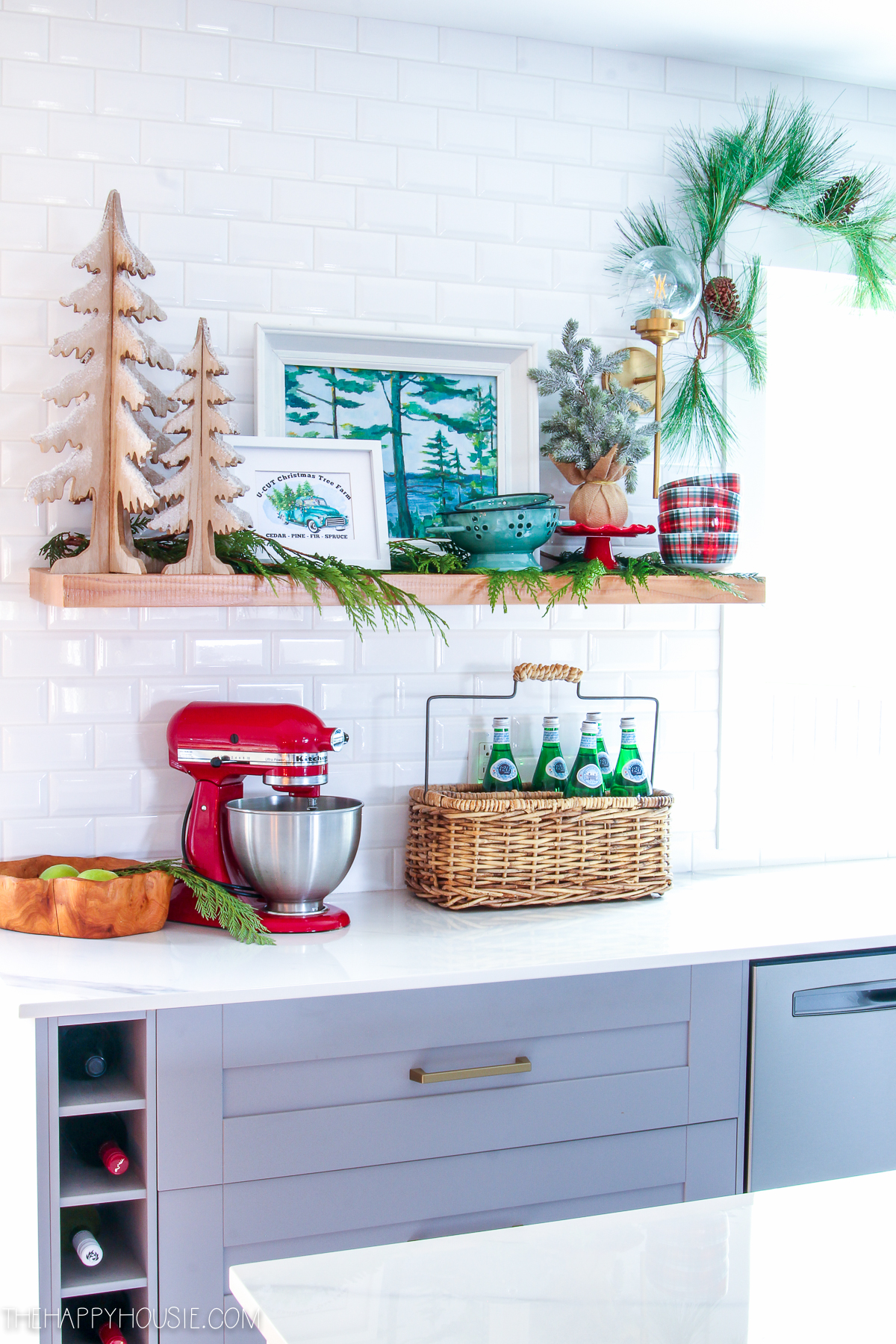 A light and bright kitchen decorated for the holidays.