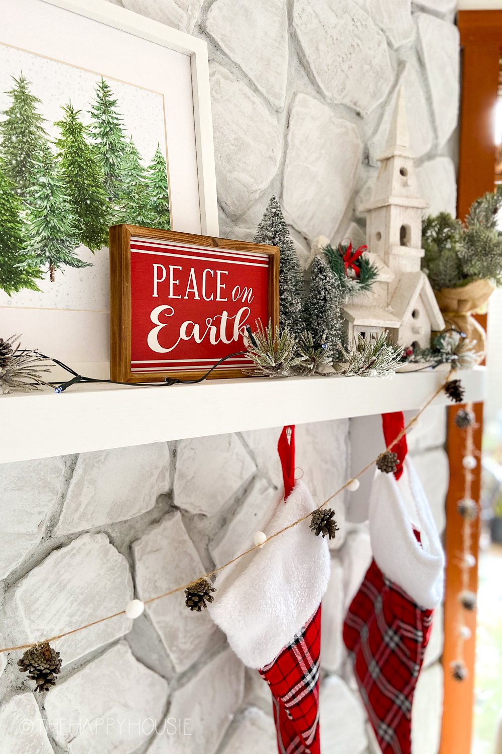 Peace On Earth sign in red and white on the fireplace mantel.