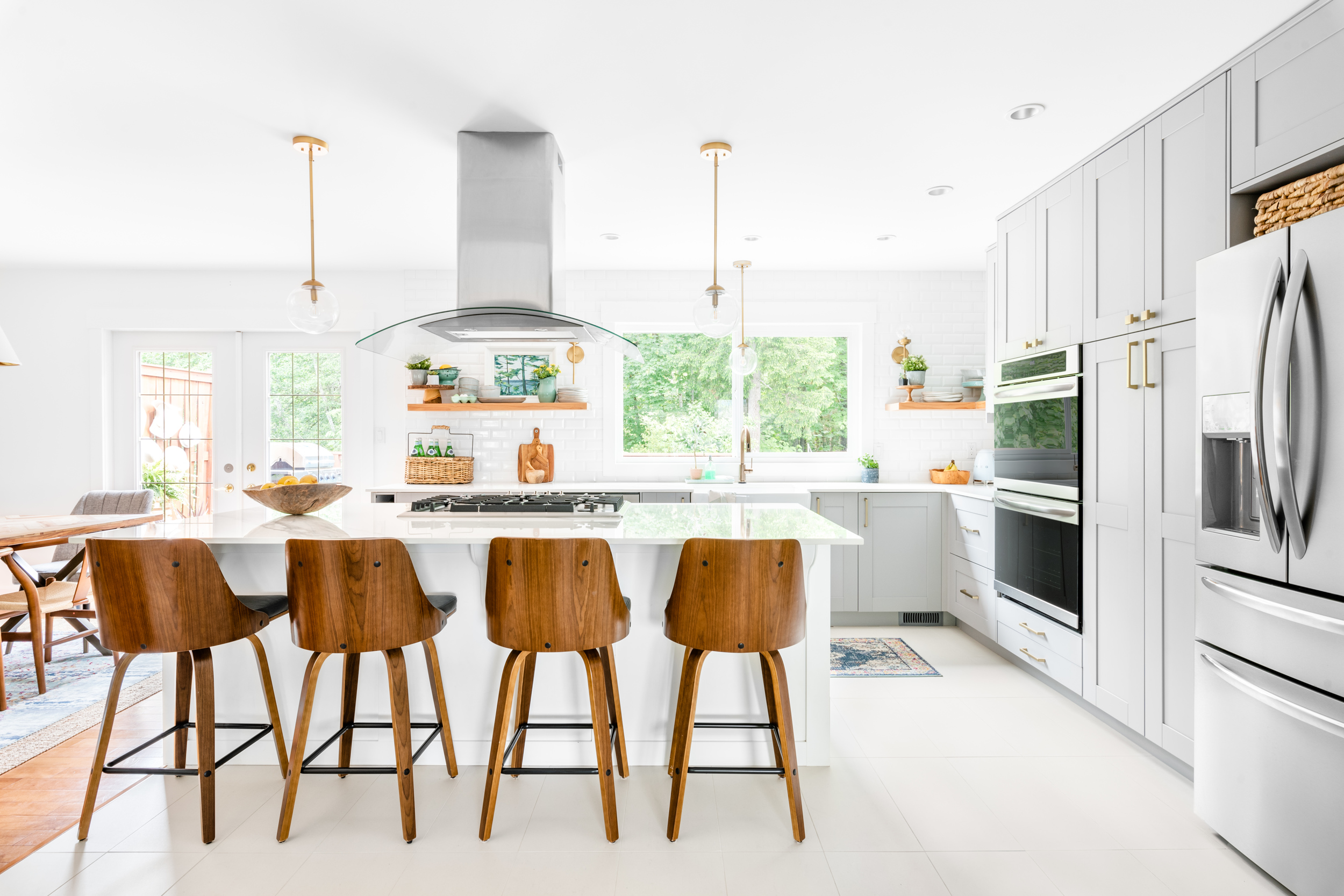 an open and bright recently renovated kitchen with Ikea Grimslov Gray cabinets