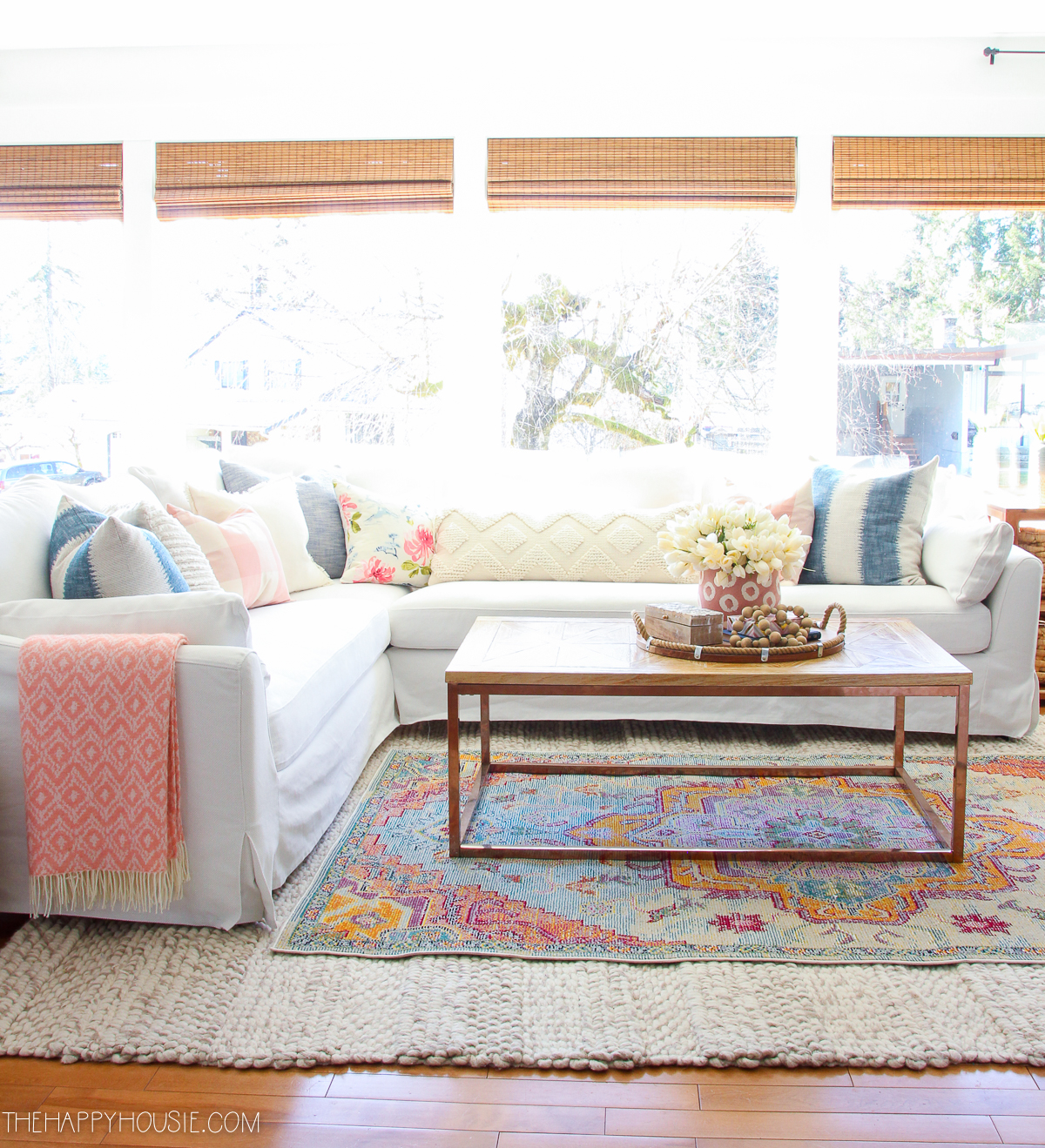 A white rug is in the living room.