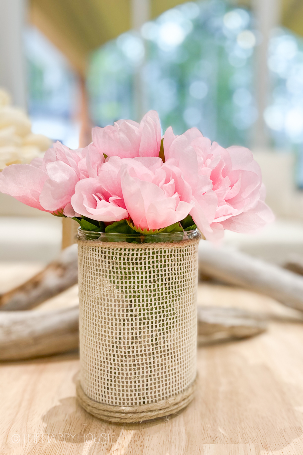 The pink peonies in the vase.