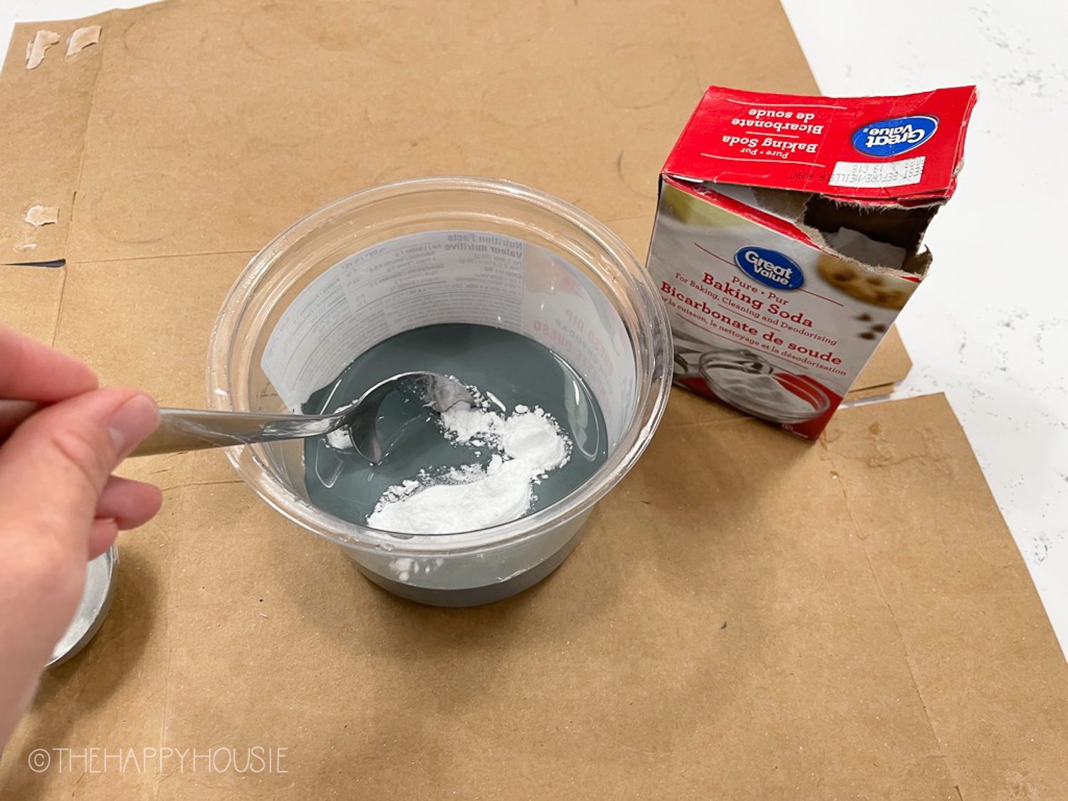 Mixing the paint with the baking soda.
