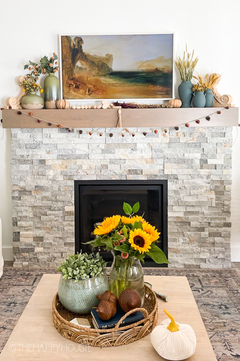 A banner of acorns is strung around the fireplace mantel.
