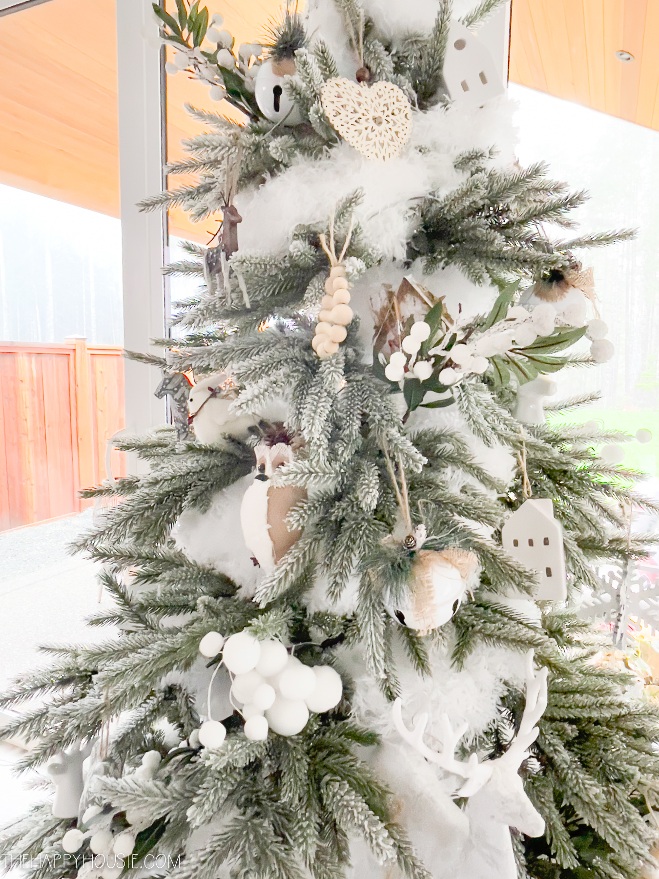 There is white Christmas items on the tree.