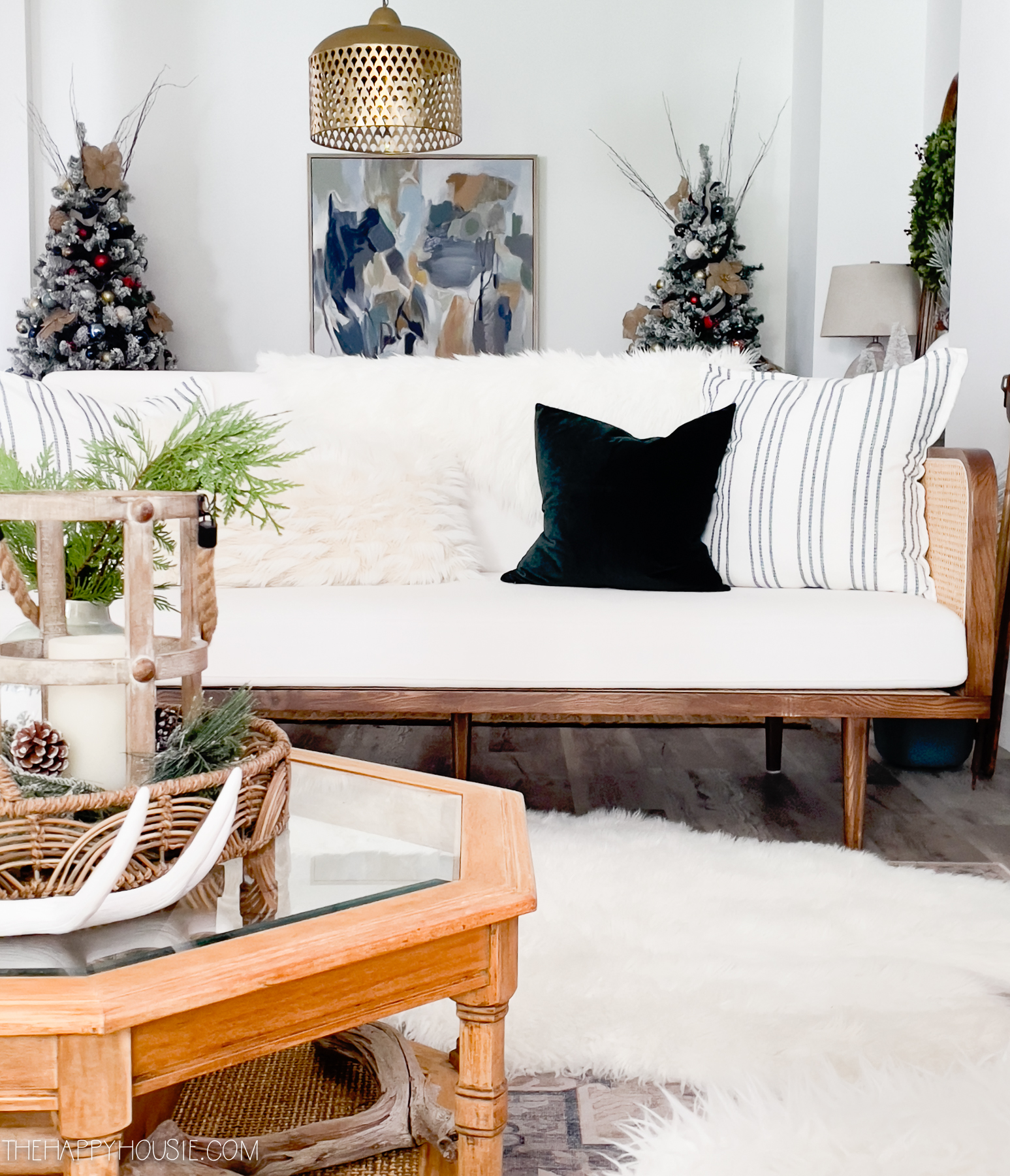 A white loveseat is in the living room.