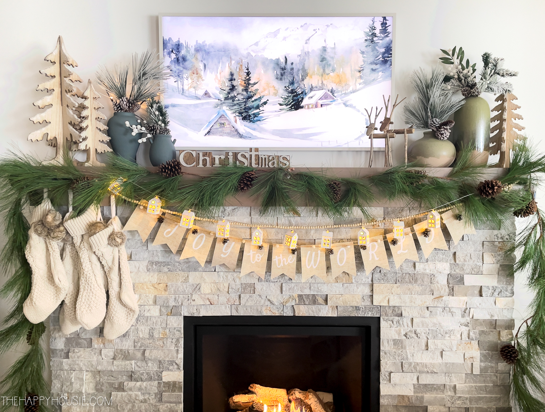 Christmas banners are strung across the fireplace.