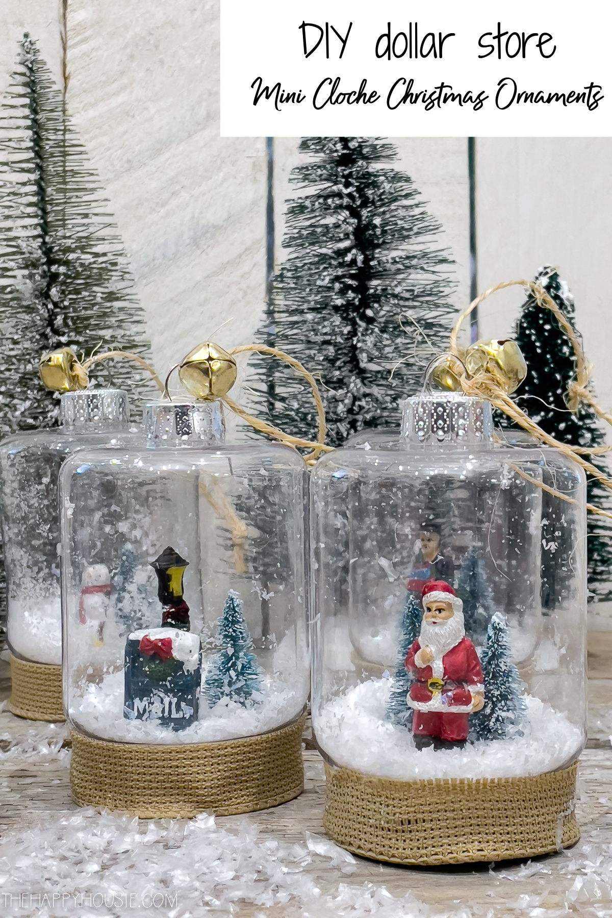 Mini cloche with Santa and snowy scenes inside.