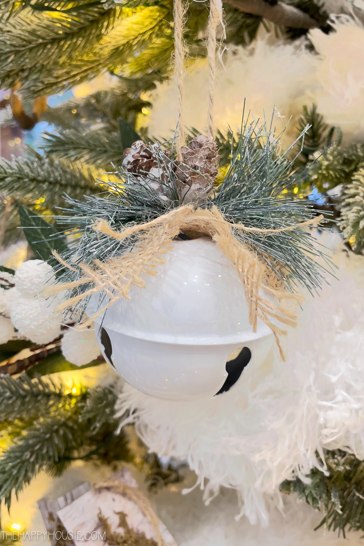 A white Christmas ball on the tree.