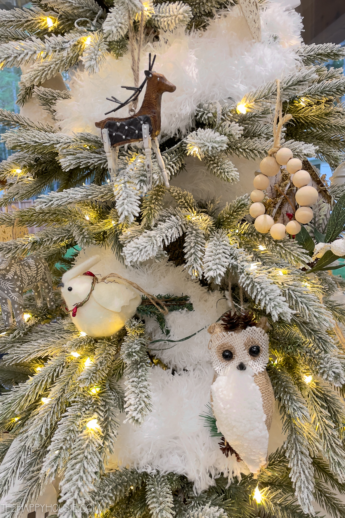 A wooden deer on the tree.