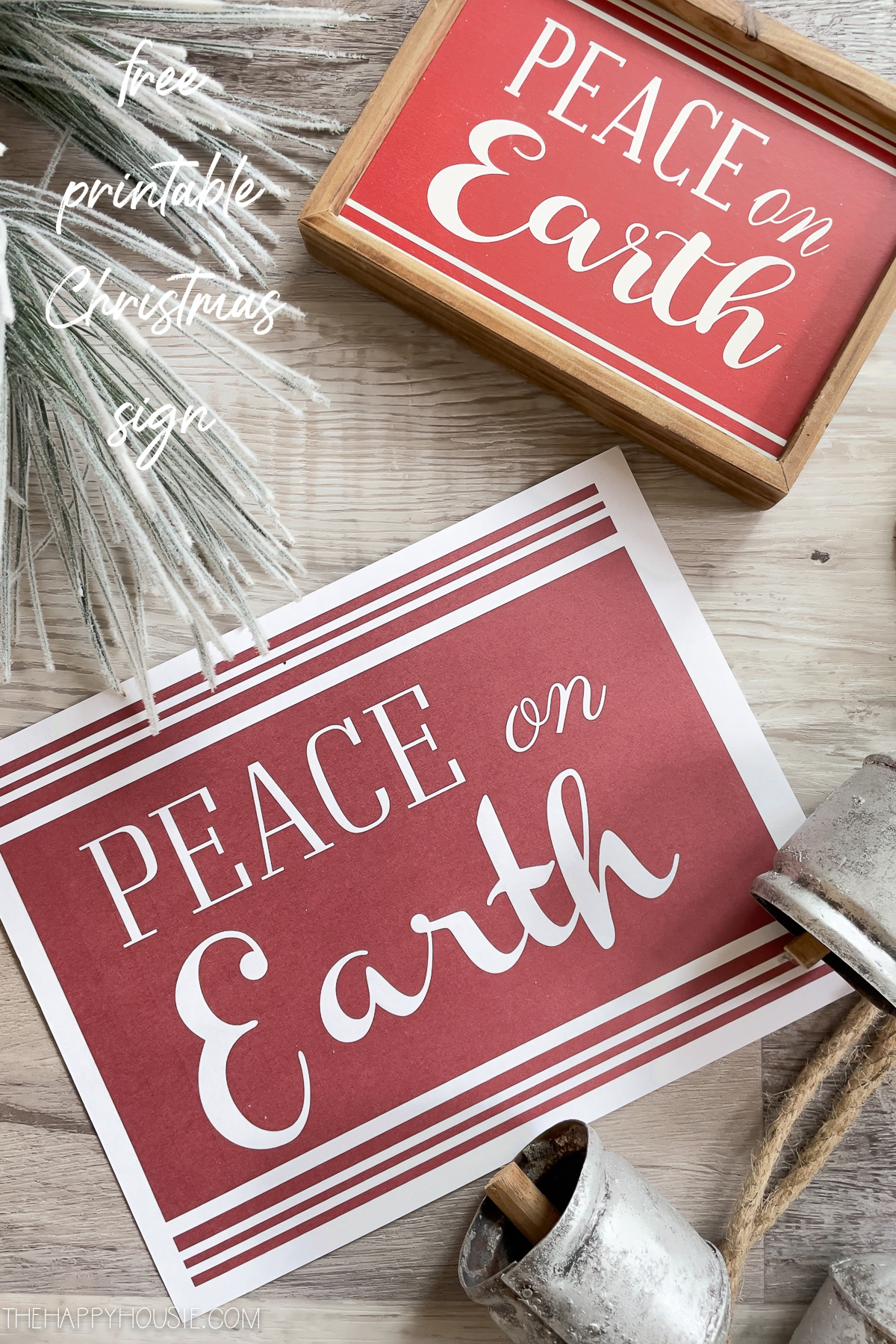 The printed sign and the framed in wood sign Peace On Earth.