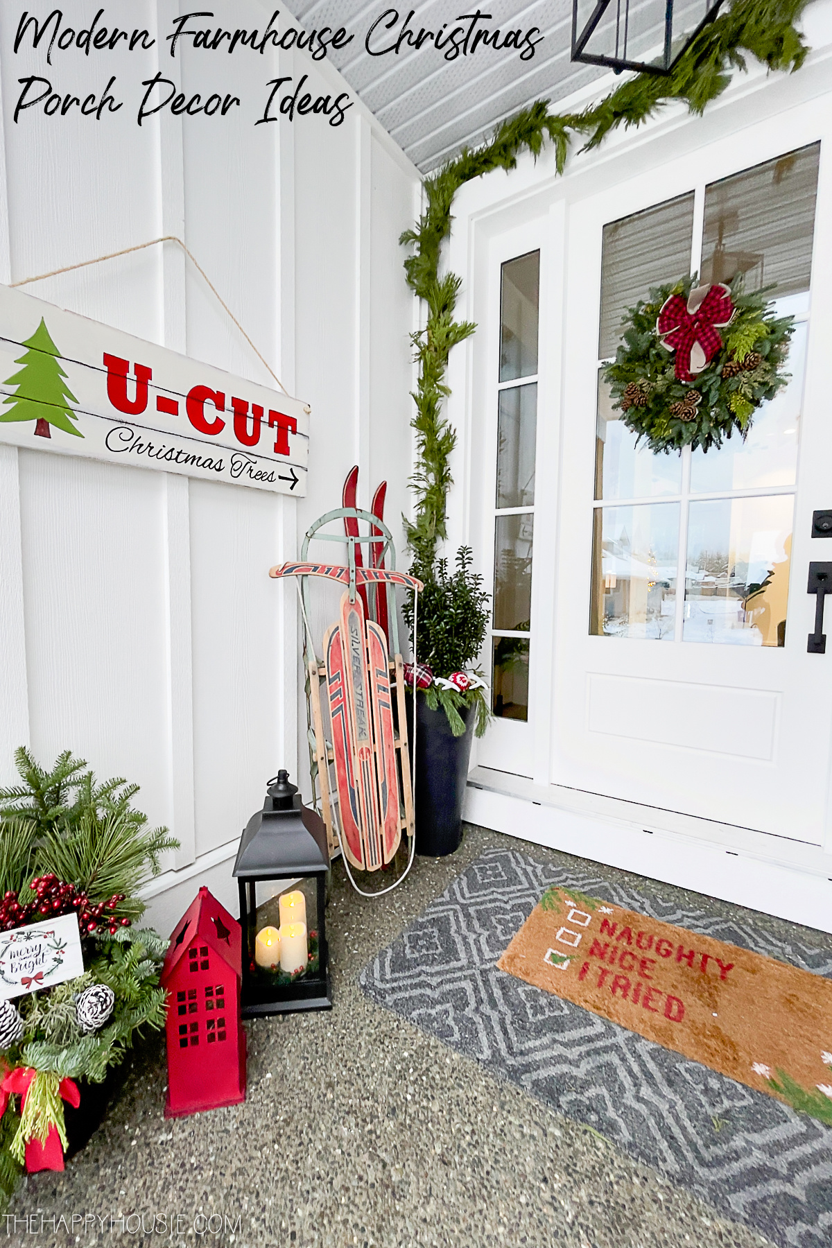front porch decorated for Christmas with Christmas greens and vintage finds