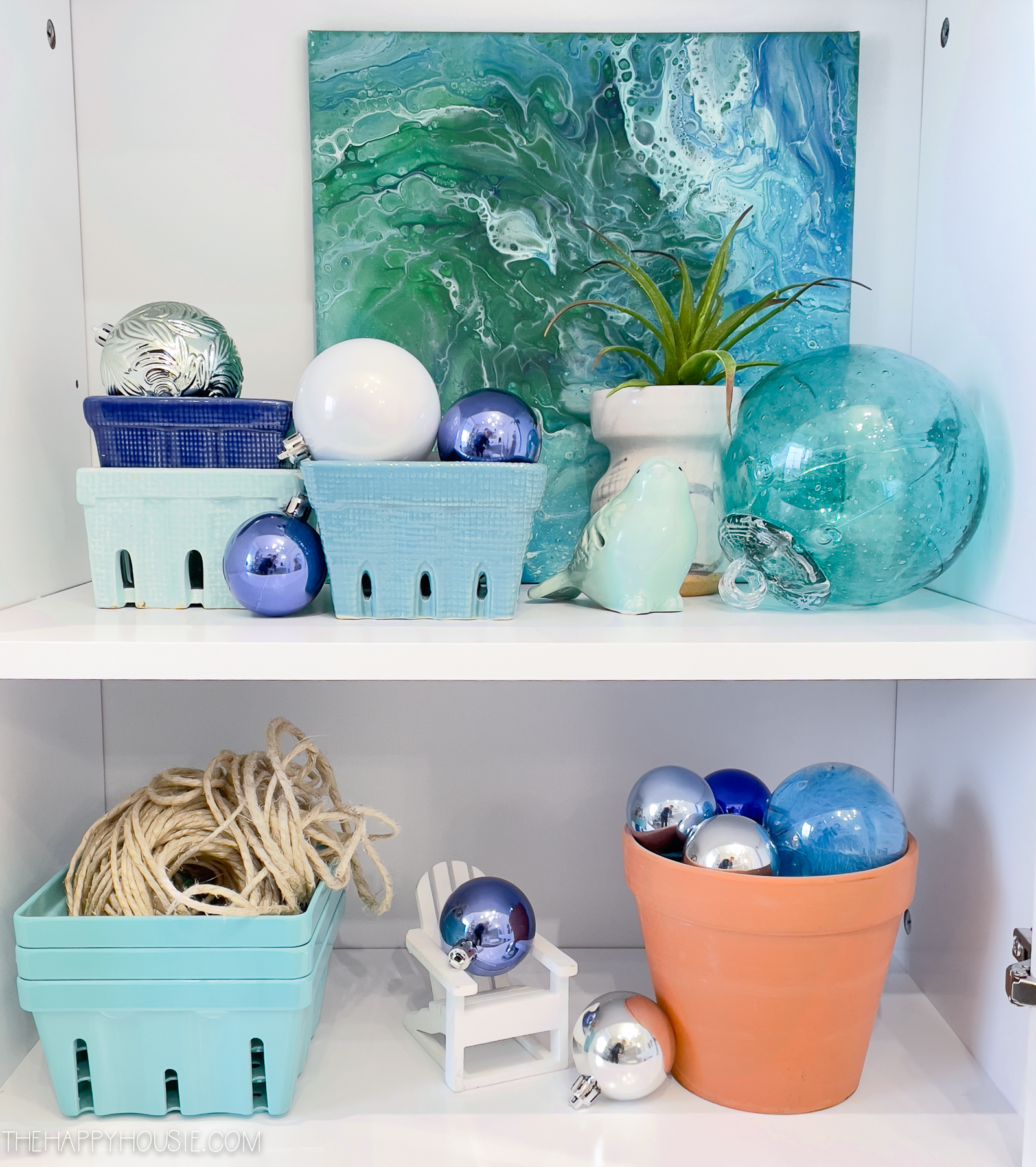 Blue and silver Christmas balls are on the shelves.