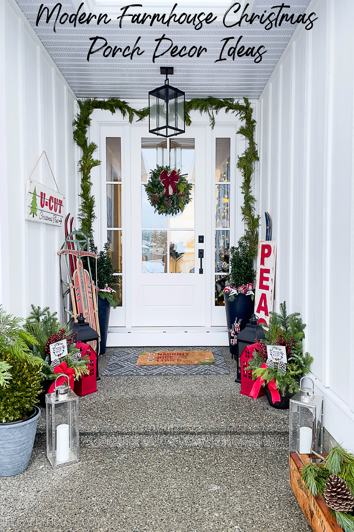 a modern farmhouse porch decorated for Christmas
