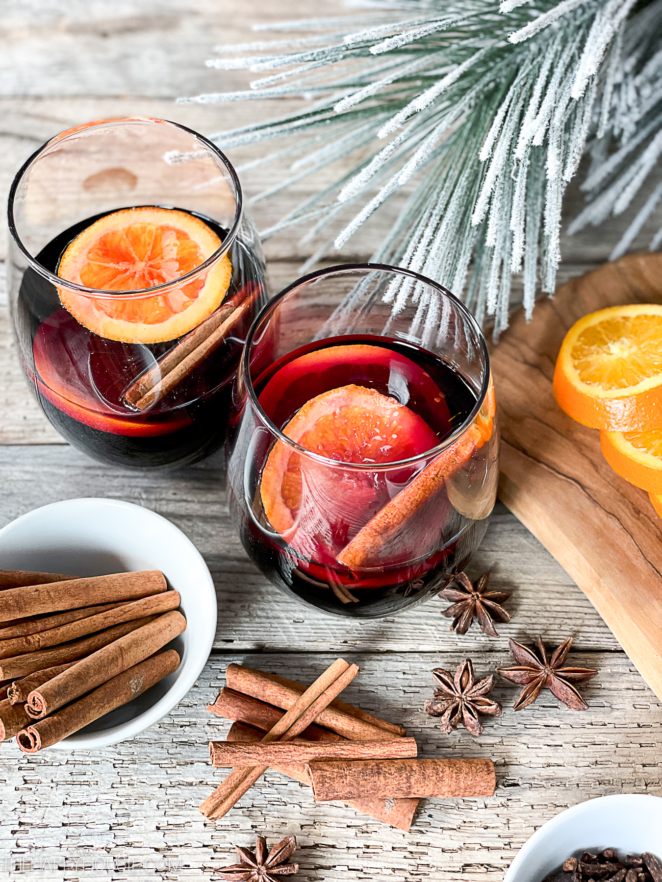 Spiced mulled wine made with raw cinnamon and fresh orange slices