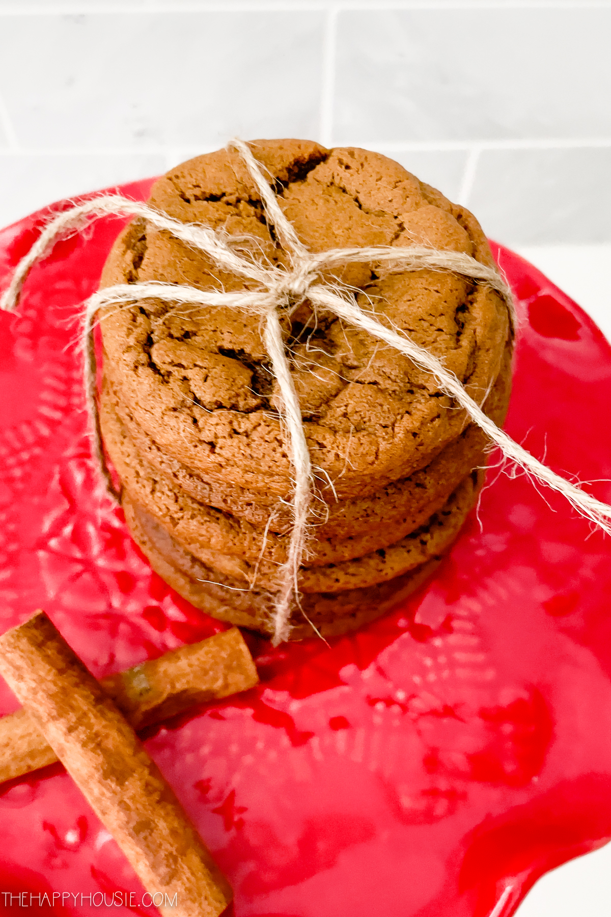 a stack of soft and chewy ginger cookies tied together with twine