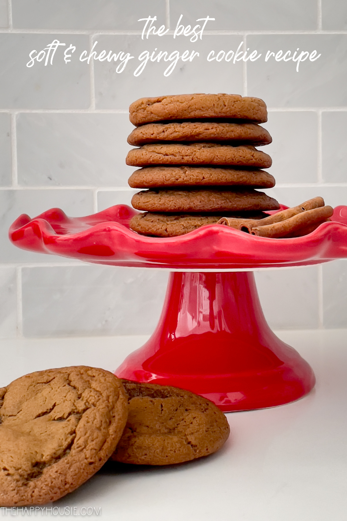 soft and chewy delicious ginger cookies stacked on a pedestal tray