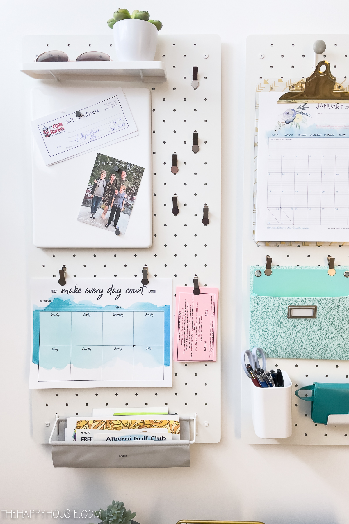 magnetic memo board and clips for hanging up papers on a pegboard wall organizer